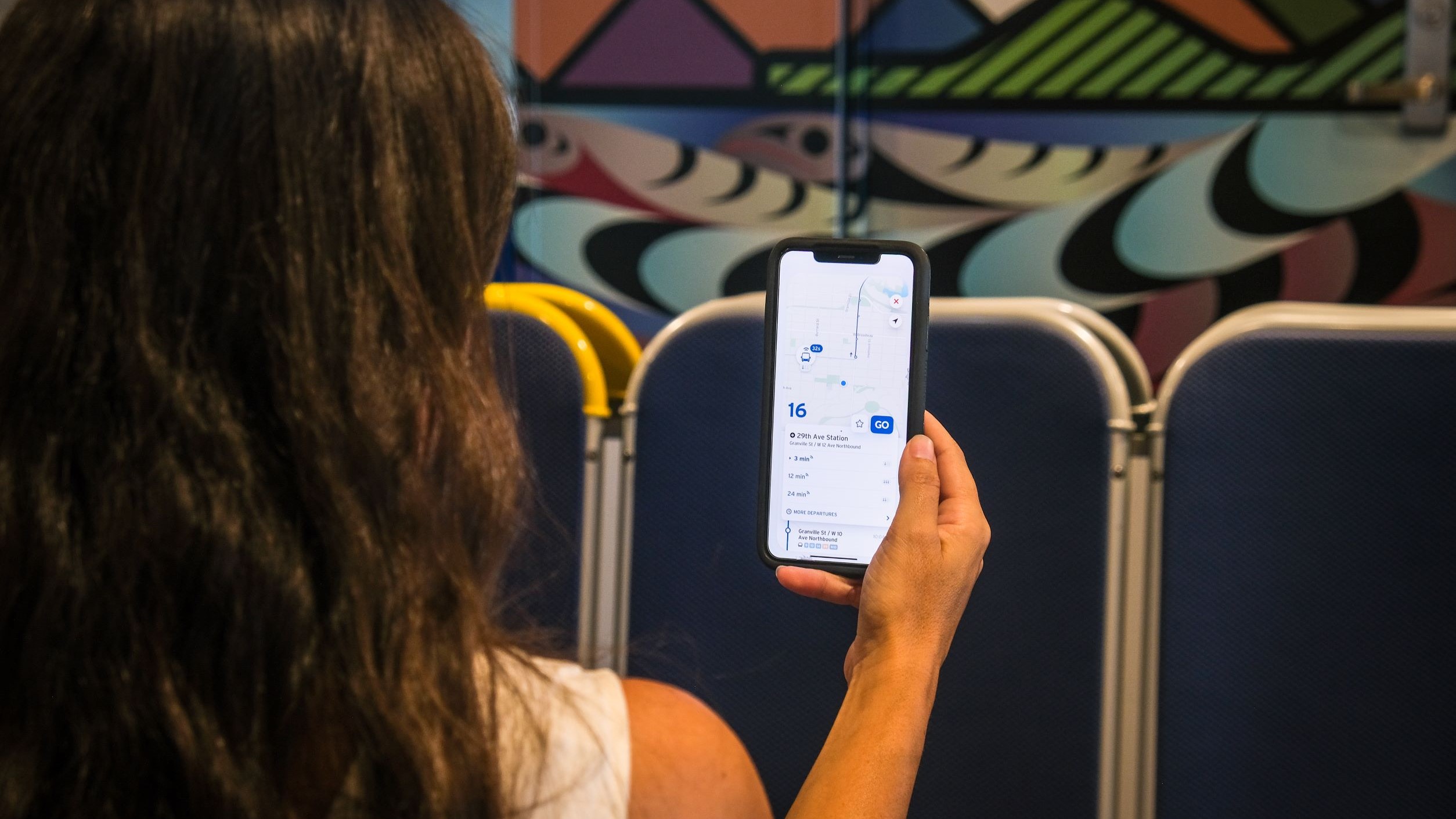 Customer using the Transit app onboard the Burrard Chinook SeaBus