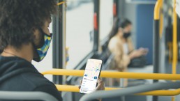 Rendering of customer using Transit app on the bus