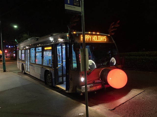 A photograph of the Reindeer Bus at night