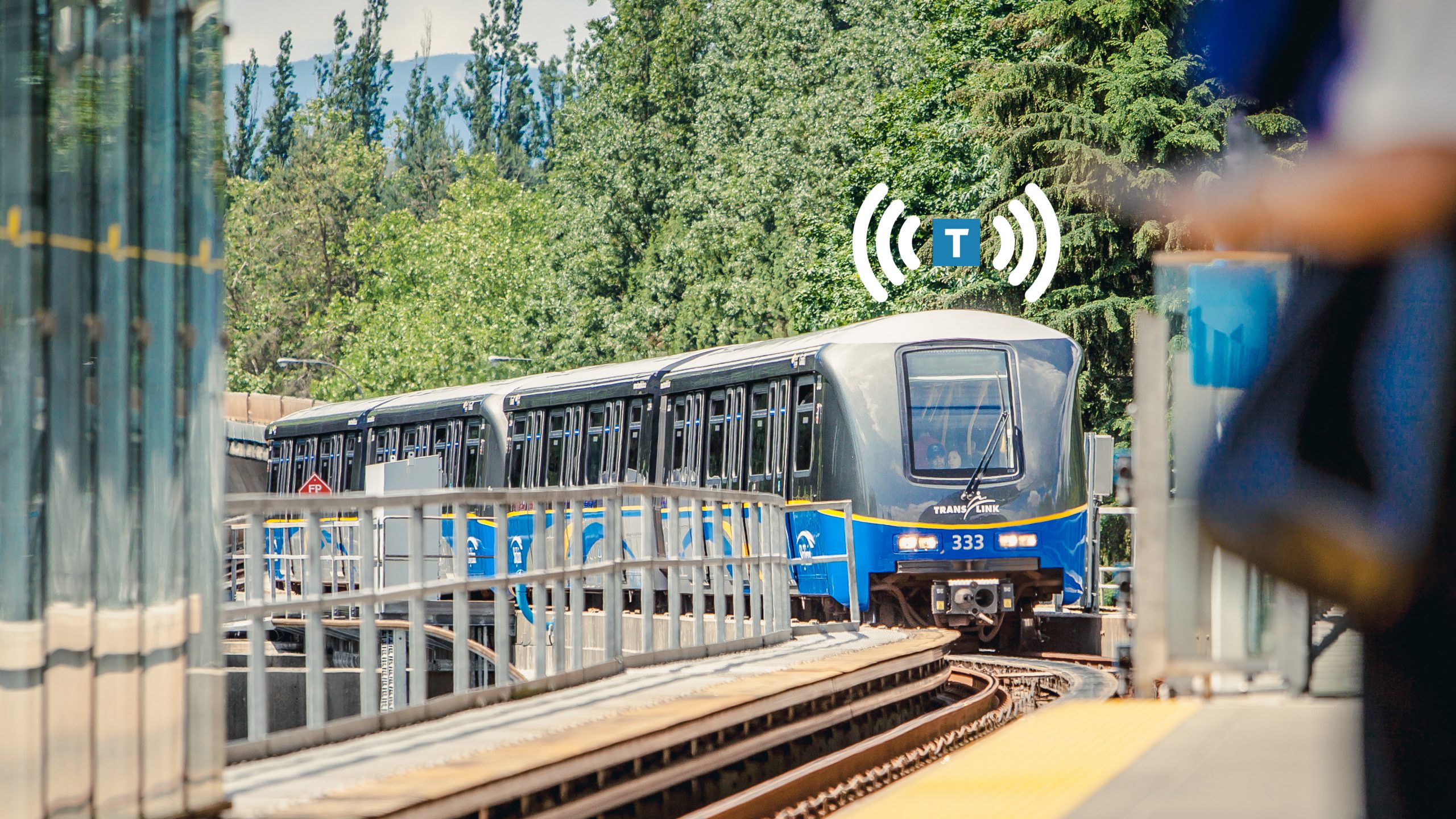 SkyTrain with TransLinkWiFi symbol arriving at Lougheed Town Centre Station