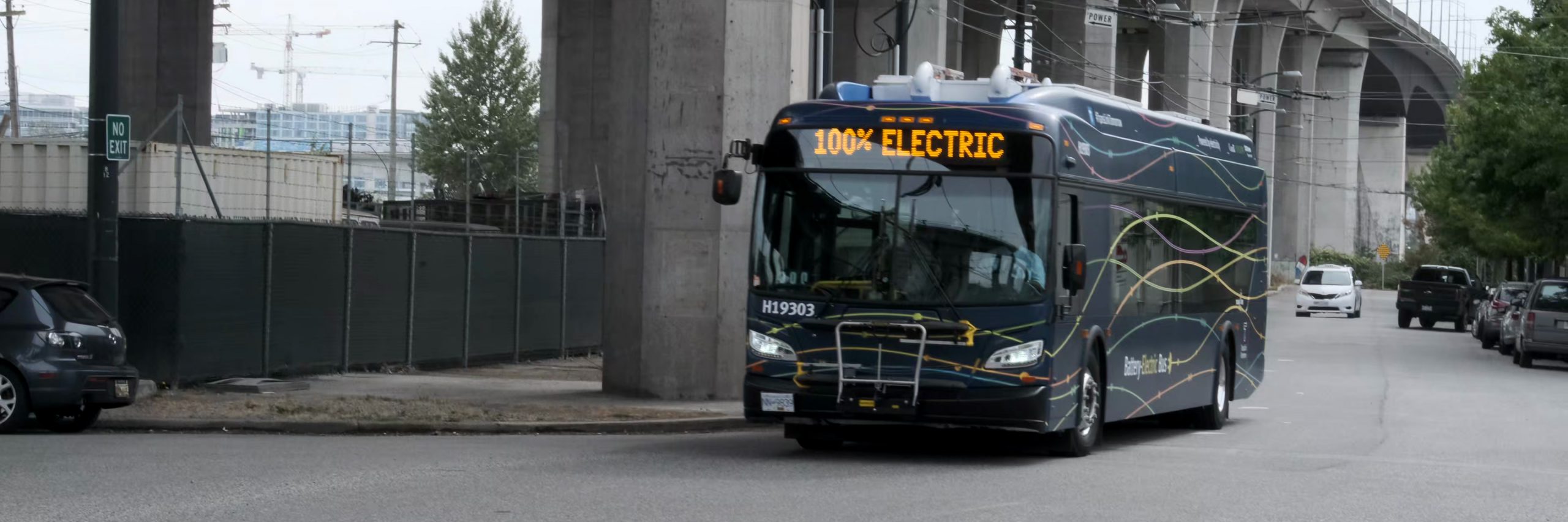 A battery-electric bus with 100 per cent electric on its destination sign