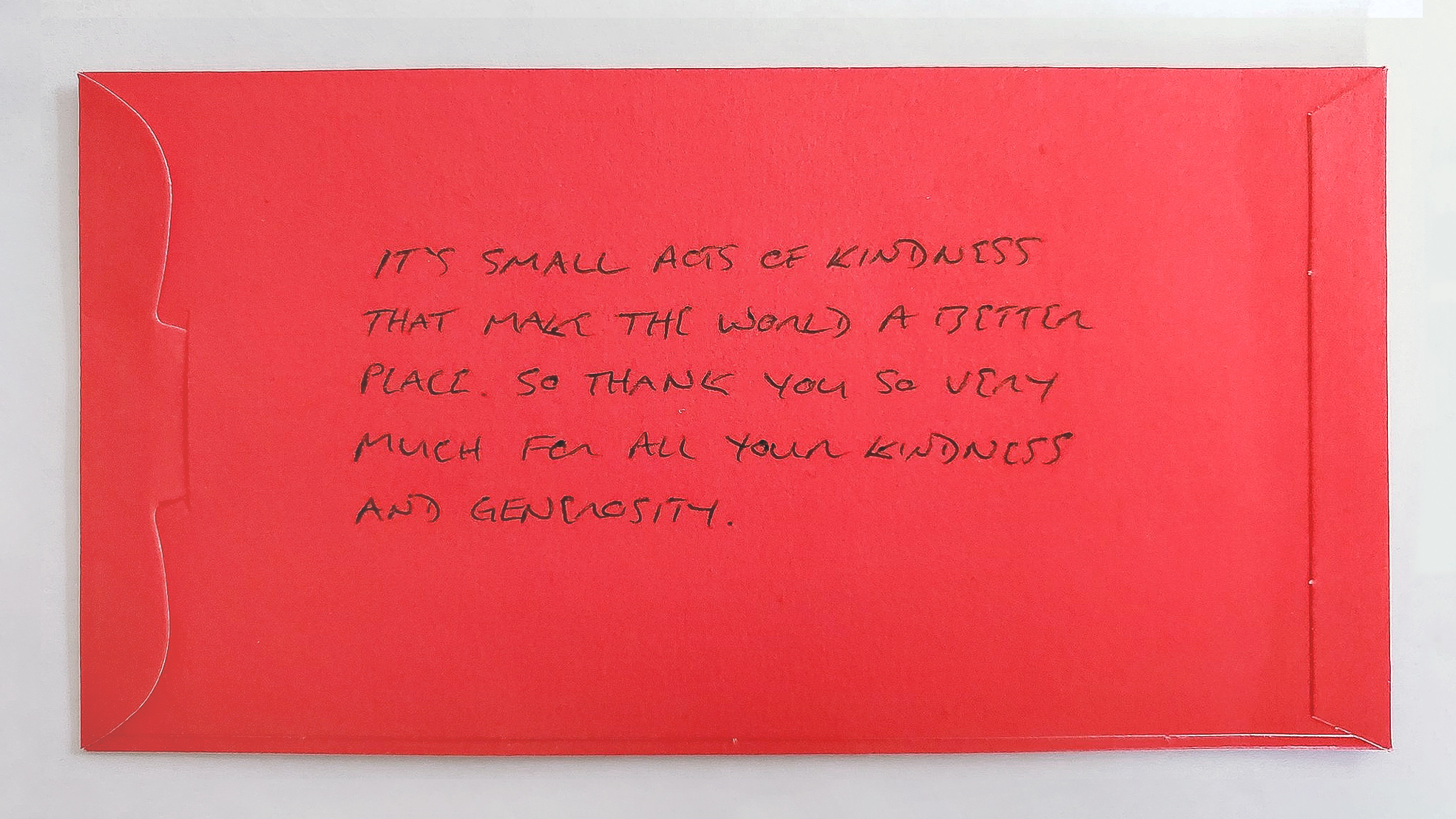 A red, thank you note that says: "It's small acts of kindness that makes the world a better place. So thank you so very much for all your kindness and generosity."
