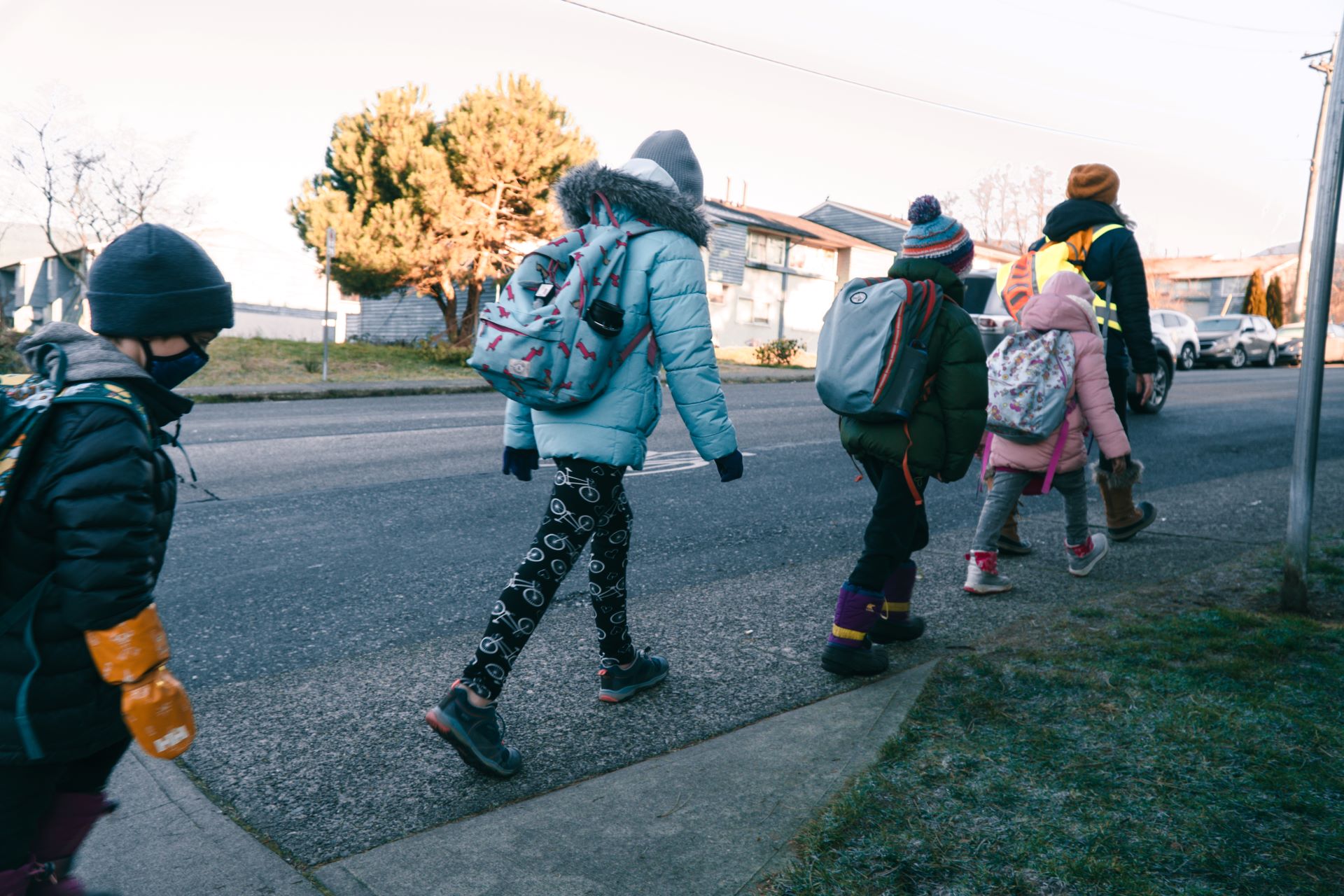 Group of students walk to Queen Mary Elementary as part of a Walking School Bus