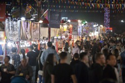 Crowds people walk by the food vendors at the Richmond Night Market in 2019