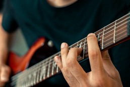 Person playing the guitar