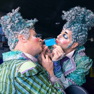 The Clowns from Cirque du Soleil's Alegría kissing the blue Compass Card