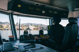 SeaBus Captain at the controls looking out