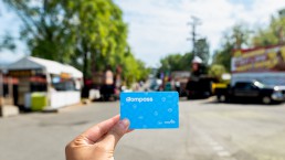 Compass Card held up behind the PNE Fairground