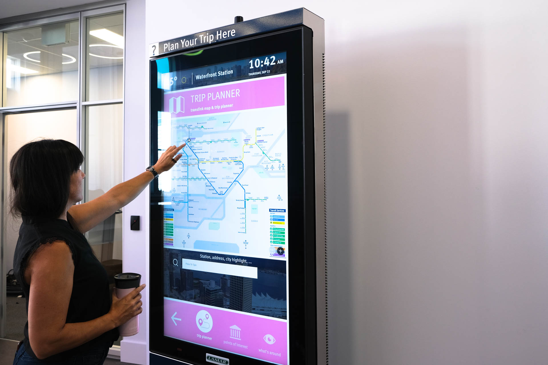 A customer using the trip-planning kiosk at the TransLink Customer Service Centre