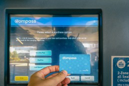 Compass Card in front of a Compass Vending Machine