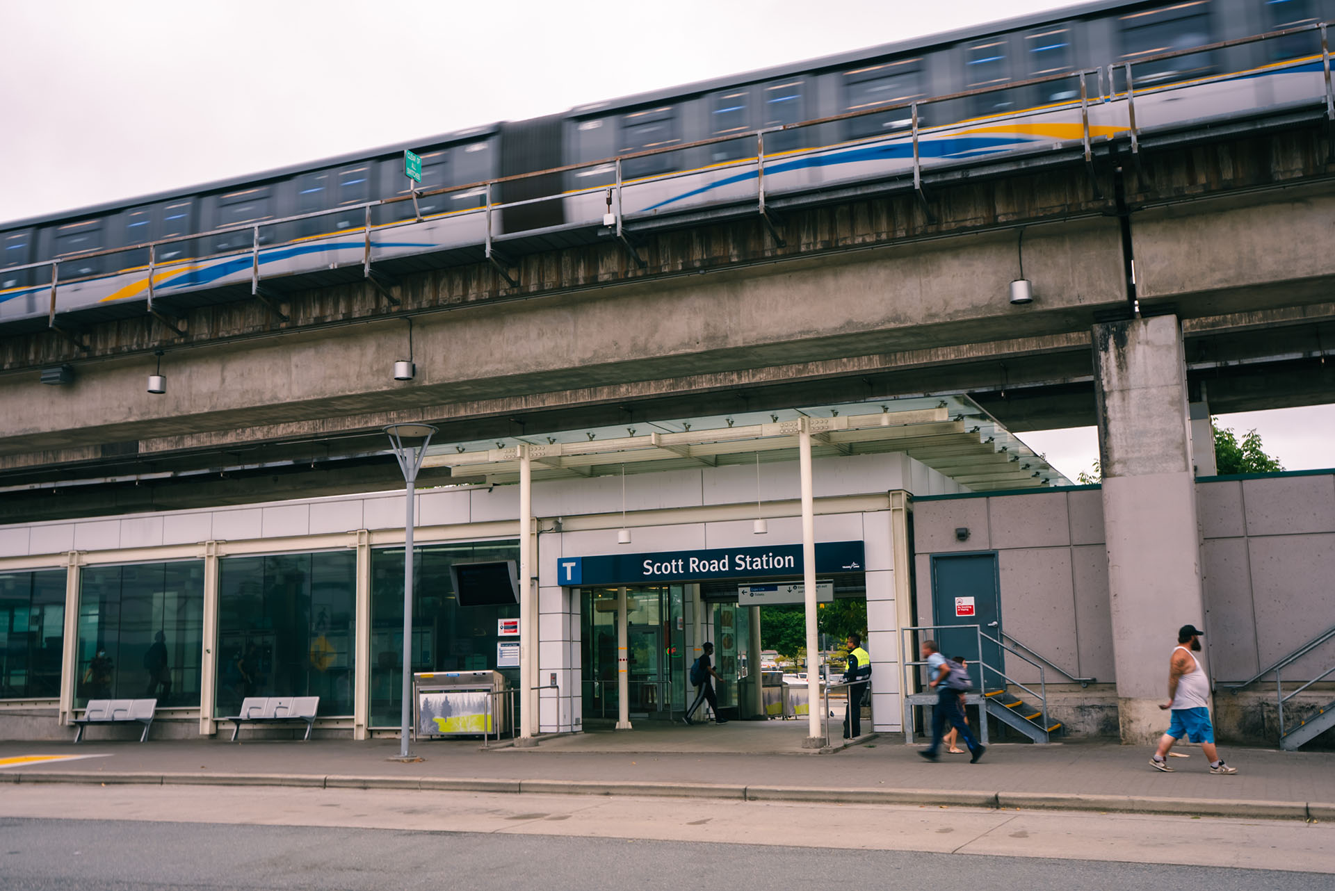 The entrance to Scott Road Station as the SkyTrain arrives