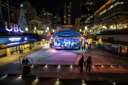 A shot of the Robson Square outdoor ice rink at night