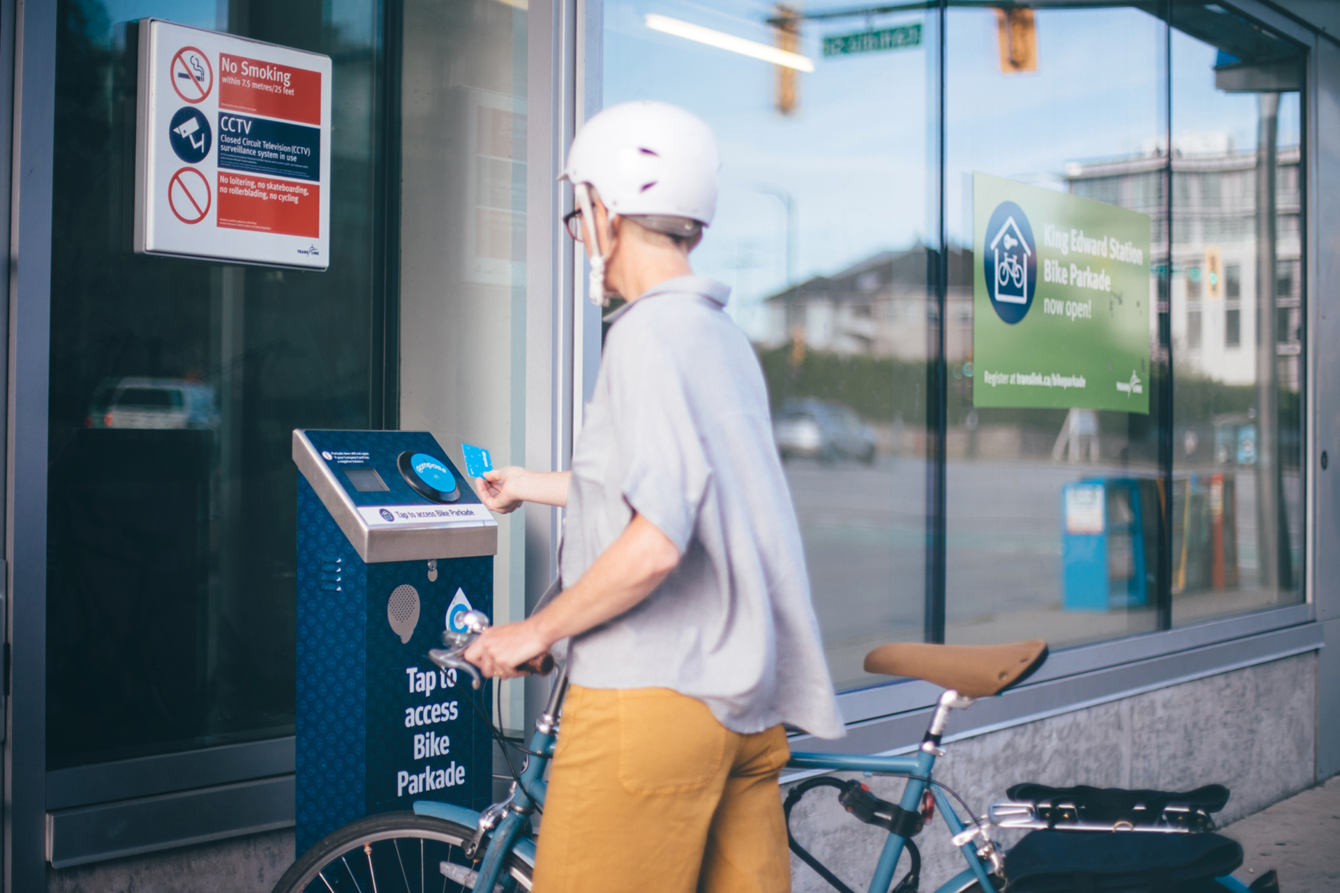 Cyclist taps Compass Card to enter the Bike Parkade
