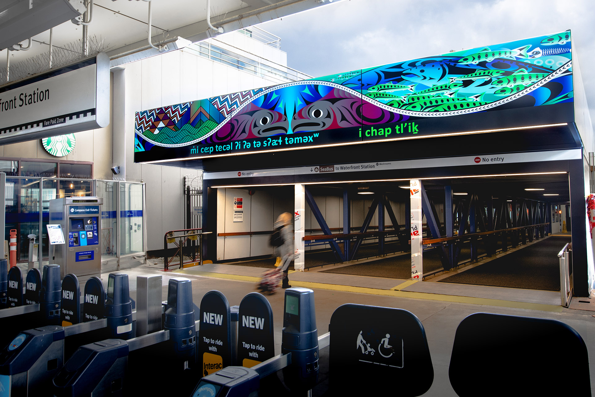 The entrance canopy at the Lonsdale Quay terminal displaying Indigenous art and language