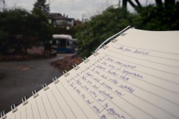 List of new year's resolutions and a bus in the background