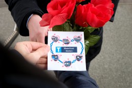 Person hands TransLink Valentines Day Card to someone