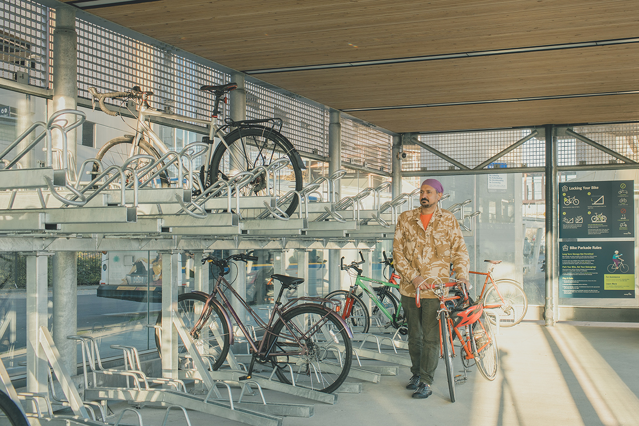 Man with his bike in a Bike Parkade