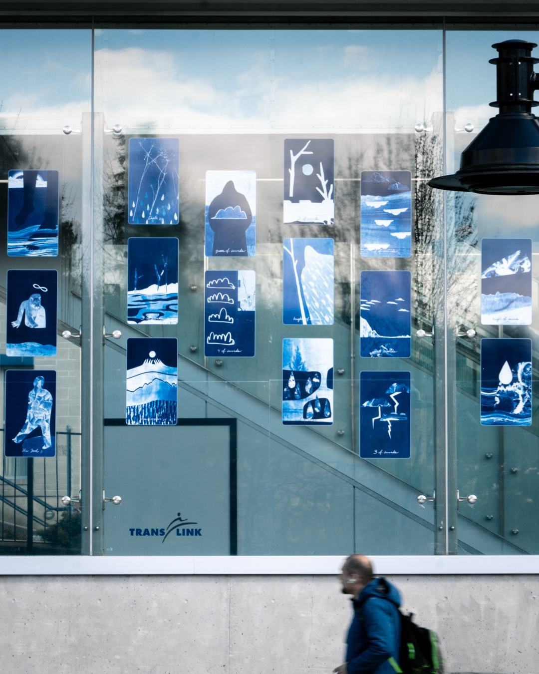 Some cards of the Blue Earth Tarot installed on the glass window at Lafarge Lake–Douglas Station