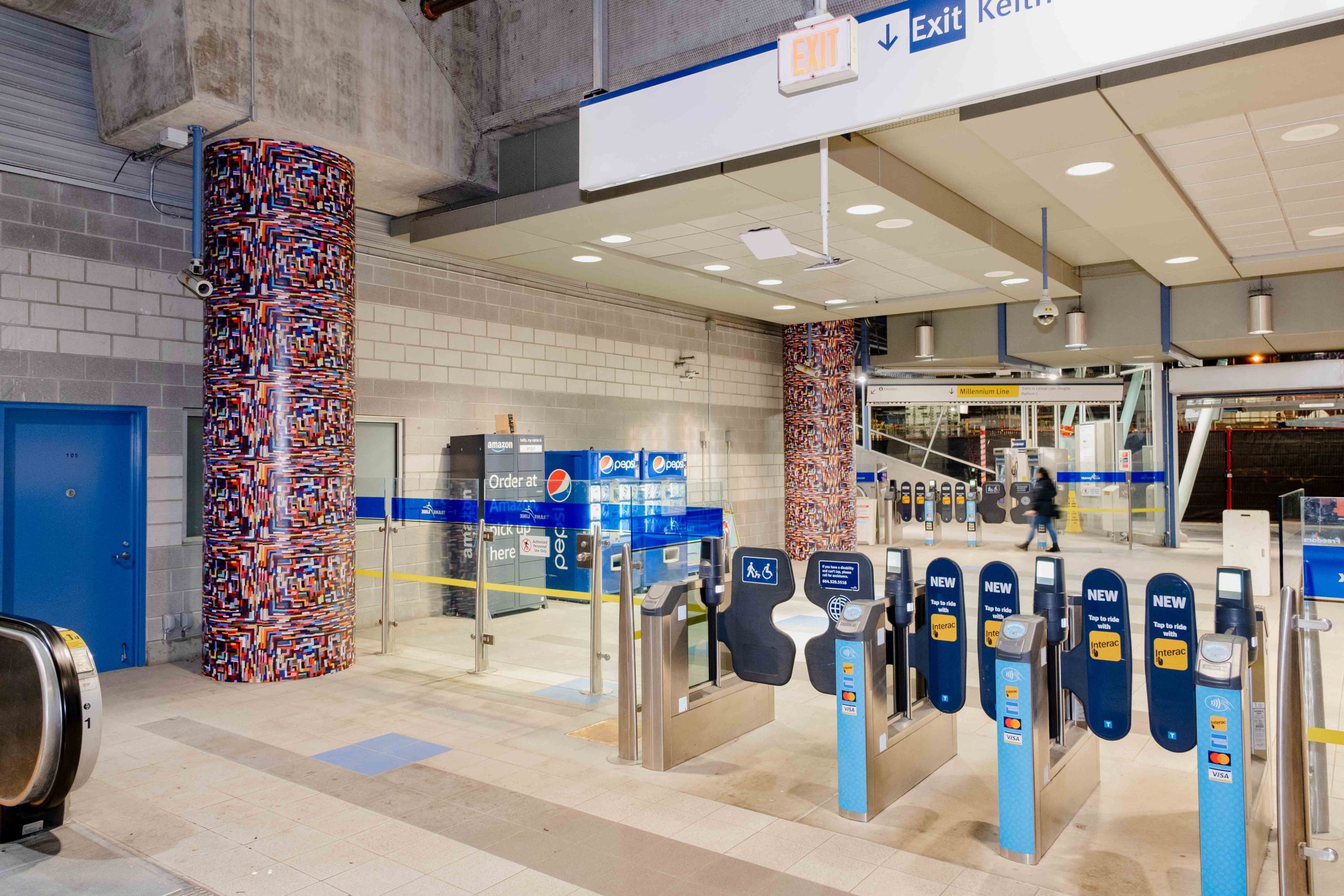 Two columns wrap artwork 'Breathe' by Jan Wade at VCC–Clark Station