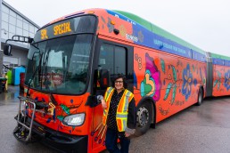 Artist Jag Nagra with the bus wrapped in her art