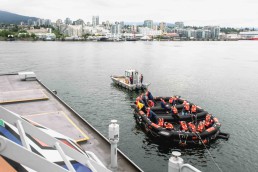 Life raft with acting passengers leaves the SeaBus during the a life raft exercise