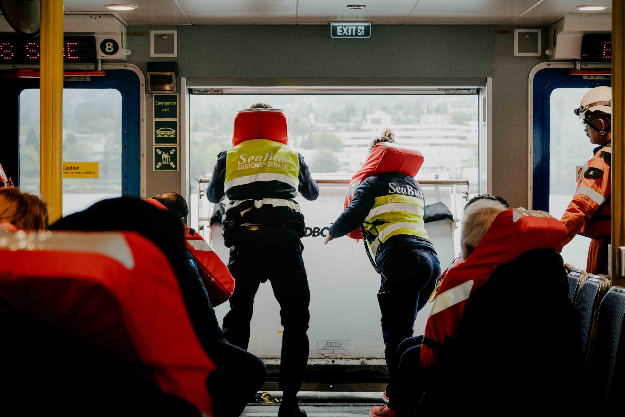 Two SeaBus crew members deploy one of the life rafts