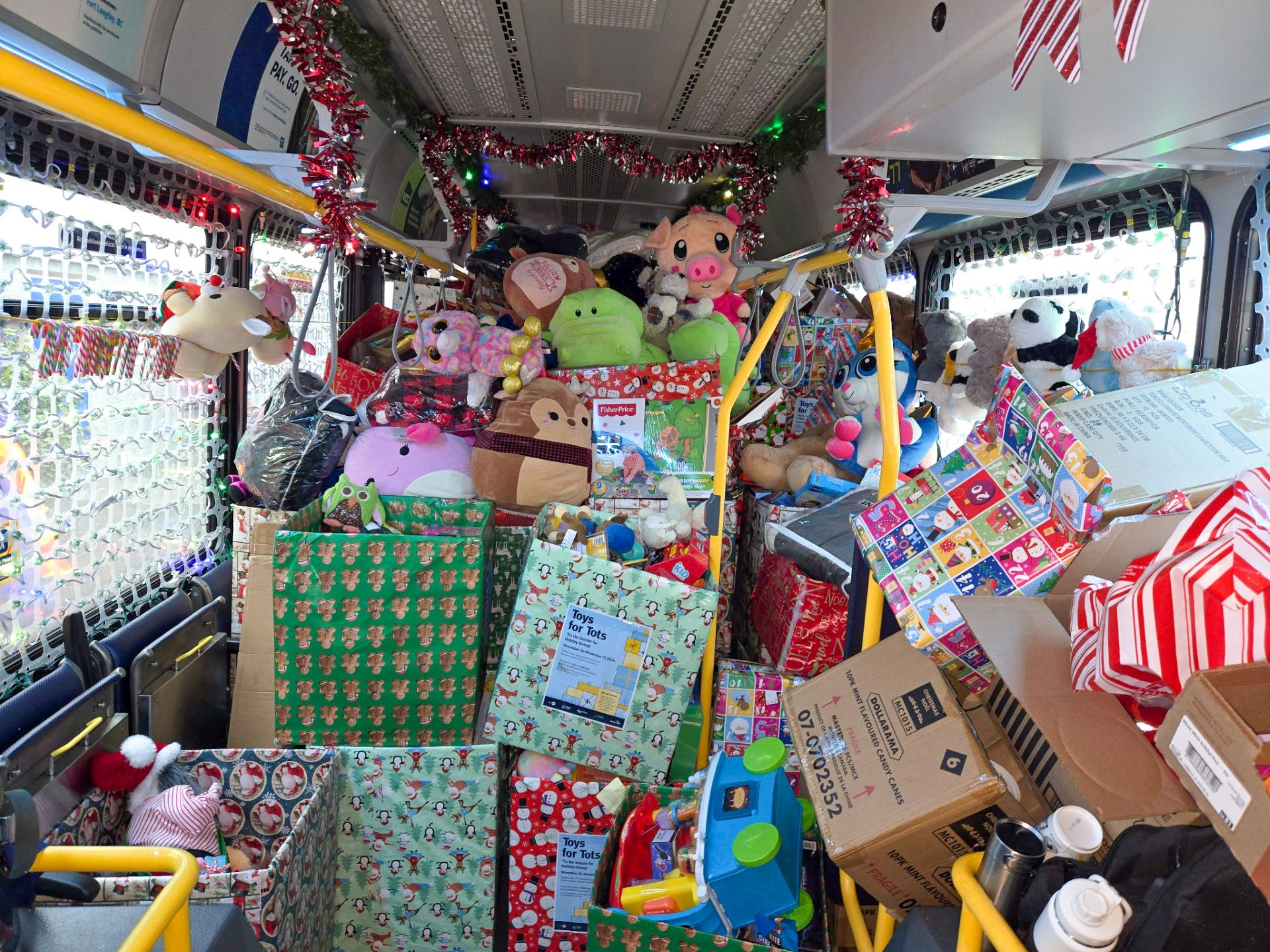 TransLink's Reindeer Bus is shown stacked to the top with toy donations for the Toys for Tots program