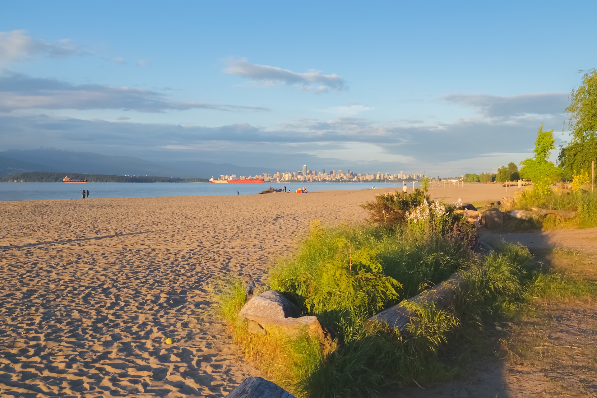 Sunset golden hour light at Spanish Banks Beach at Point Grey on an idyllic summer evening in Vancouver, B.C., Canada.