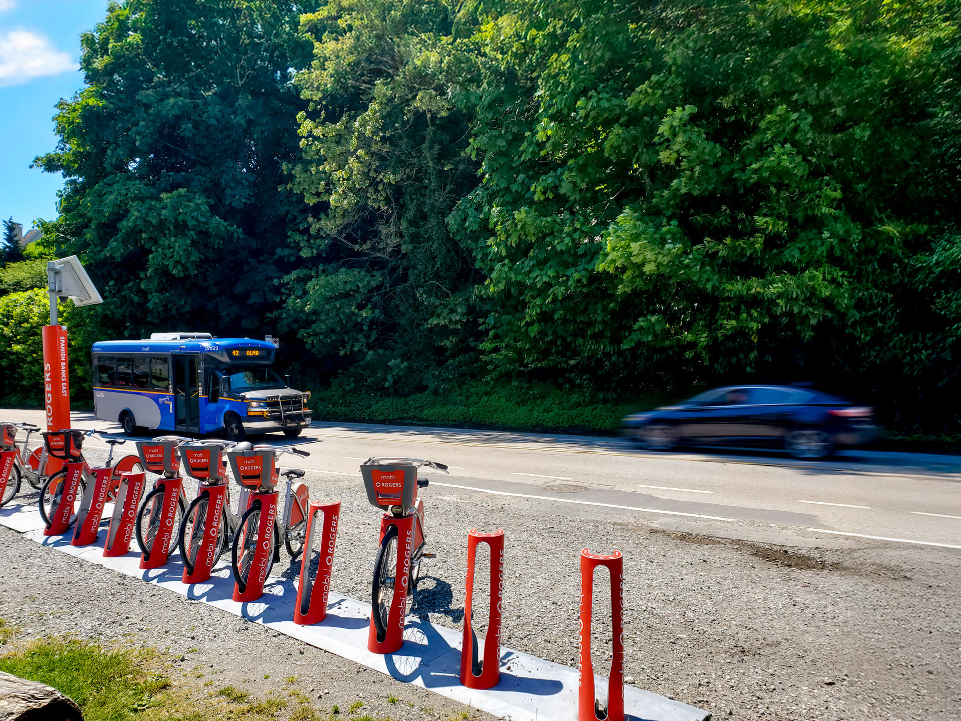 The 42 Alma bus passes by the Mobi station near Spanish Banks Beach