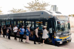 Passengers line up for the 321 White Rock bus