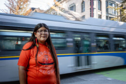 Indigenous artist Shonta Campbell models the Orange Shirt she designed for National Day for Truth and Reconciliation