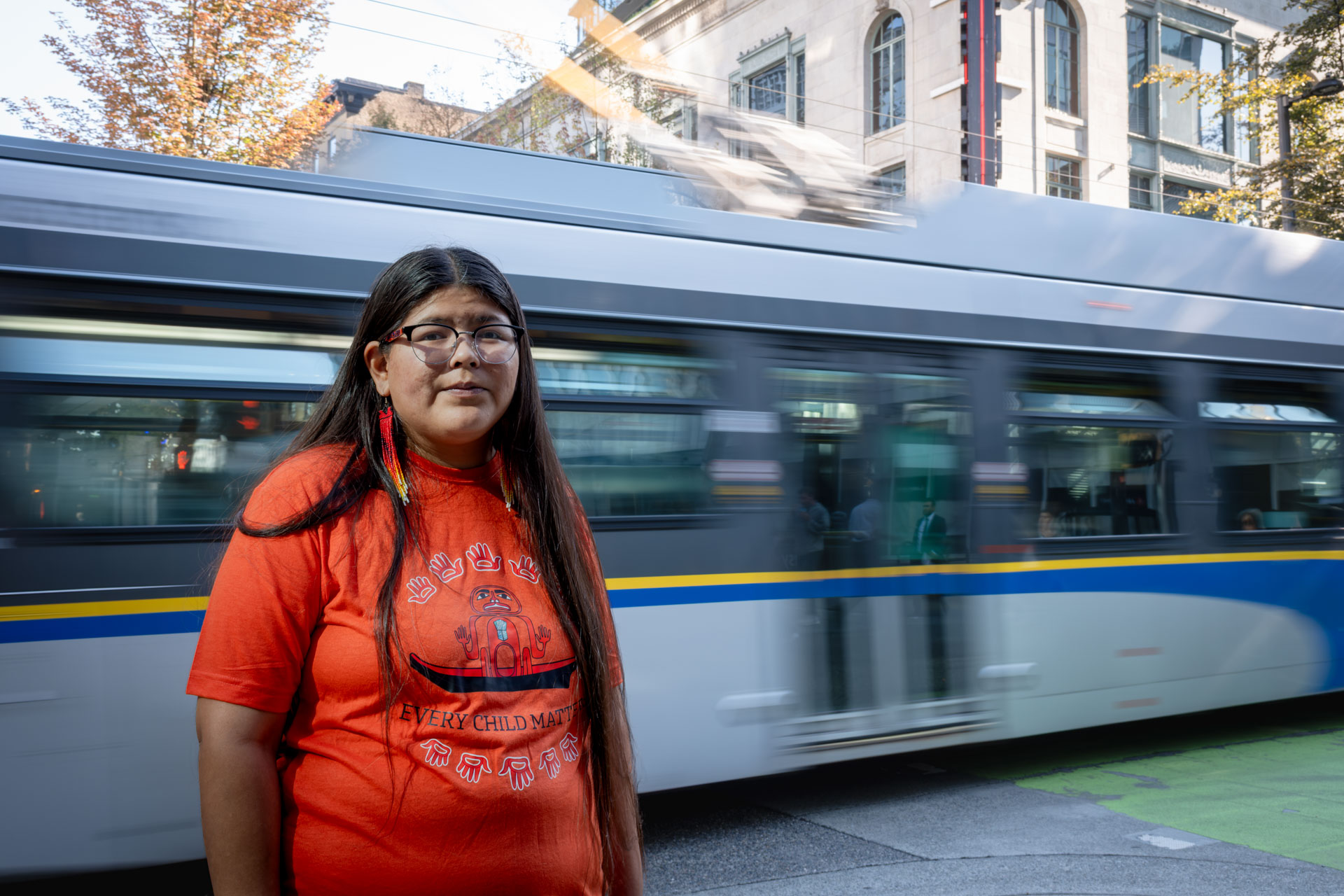 Indigenous artist Shonta Campbell models the Orange Shirt she designed for National Day for Truth and Reconciliation