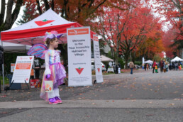 Child in unicorn costume attends the Treat Accessibly Surrey Halloween Village