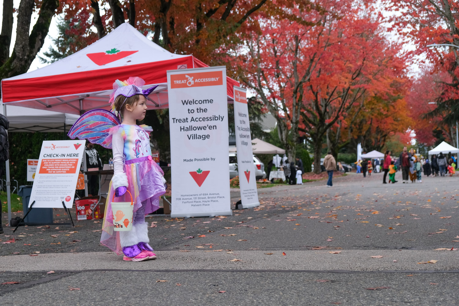 Child in unicorn costume attends the Treat Accessibly Surrey Halloween Village