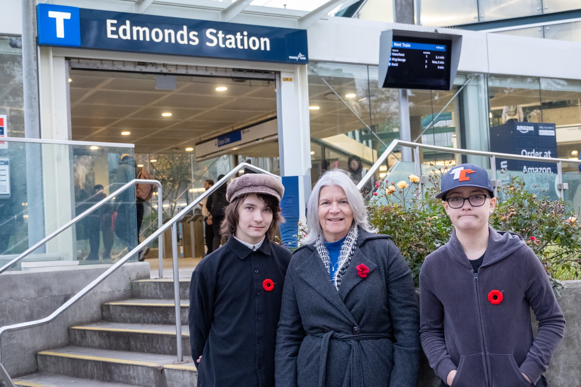 3 customers stand outside Edmonds Station
