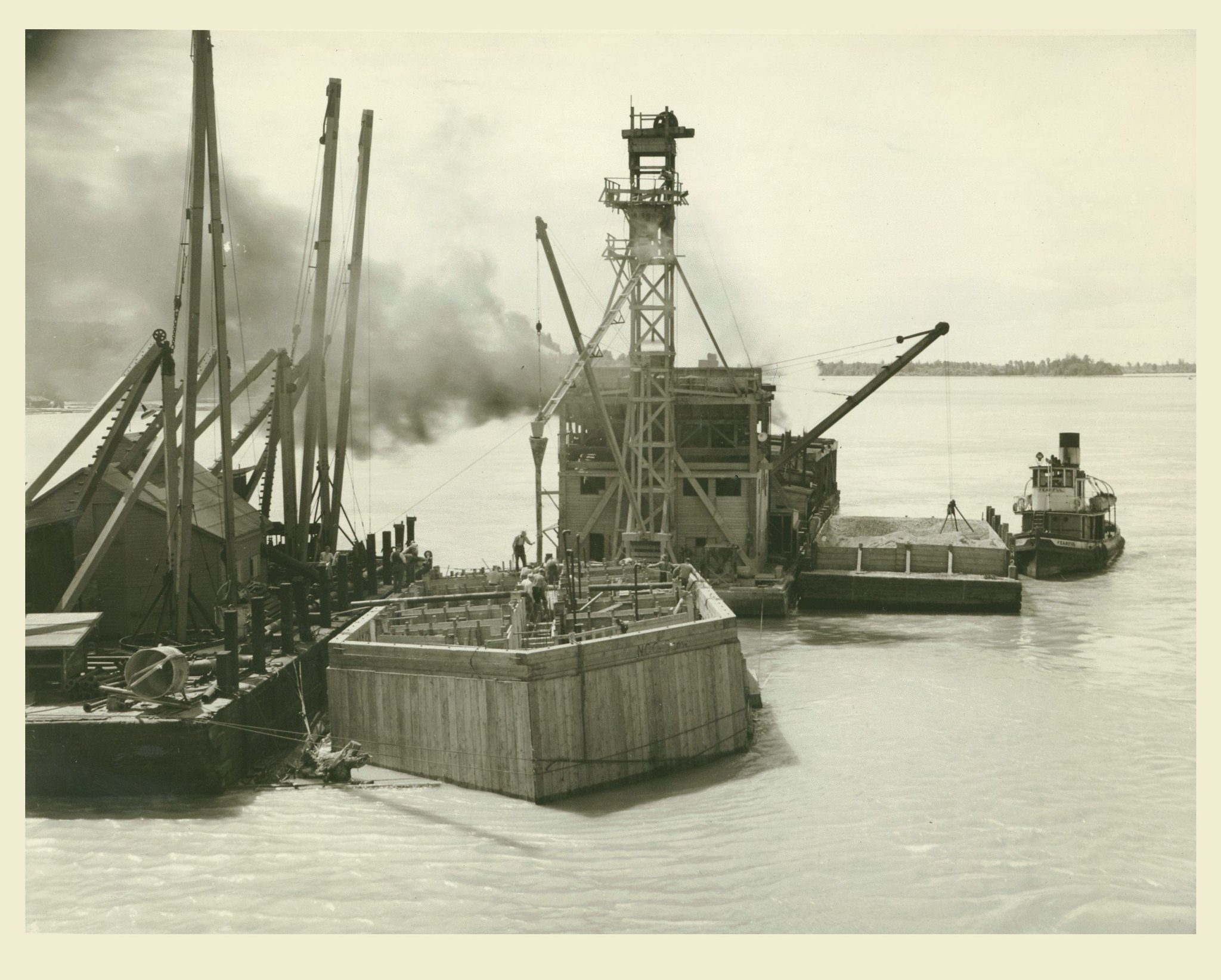 Sinking of a Coffer Dam for Construction of the Pattullo Bridge, circa 1936 A cofferdam is a watertight enclosure from which water is pumped to expose the bed of a body of water in order to permit the construction of a pier or other hydraulic work.