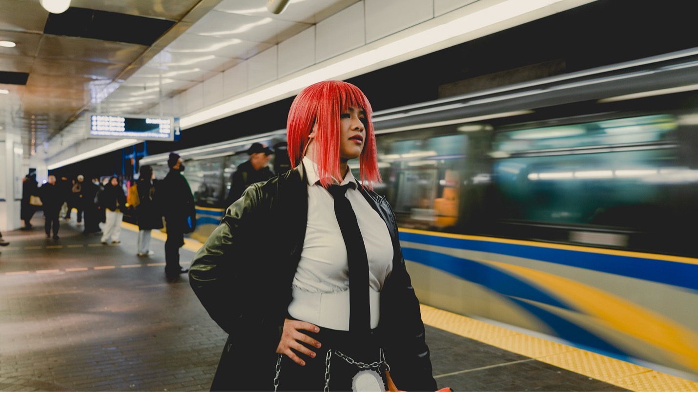 A Fan Expo Vancouver cosplayer takes the SkyTrain