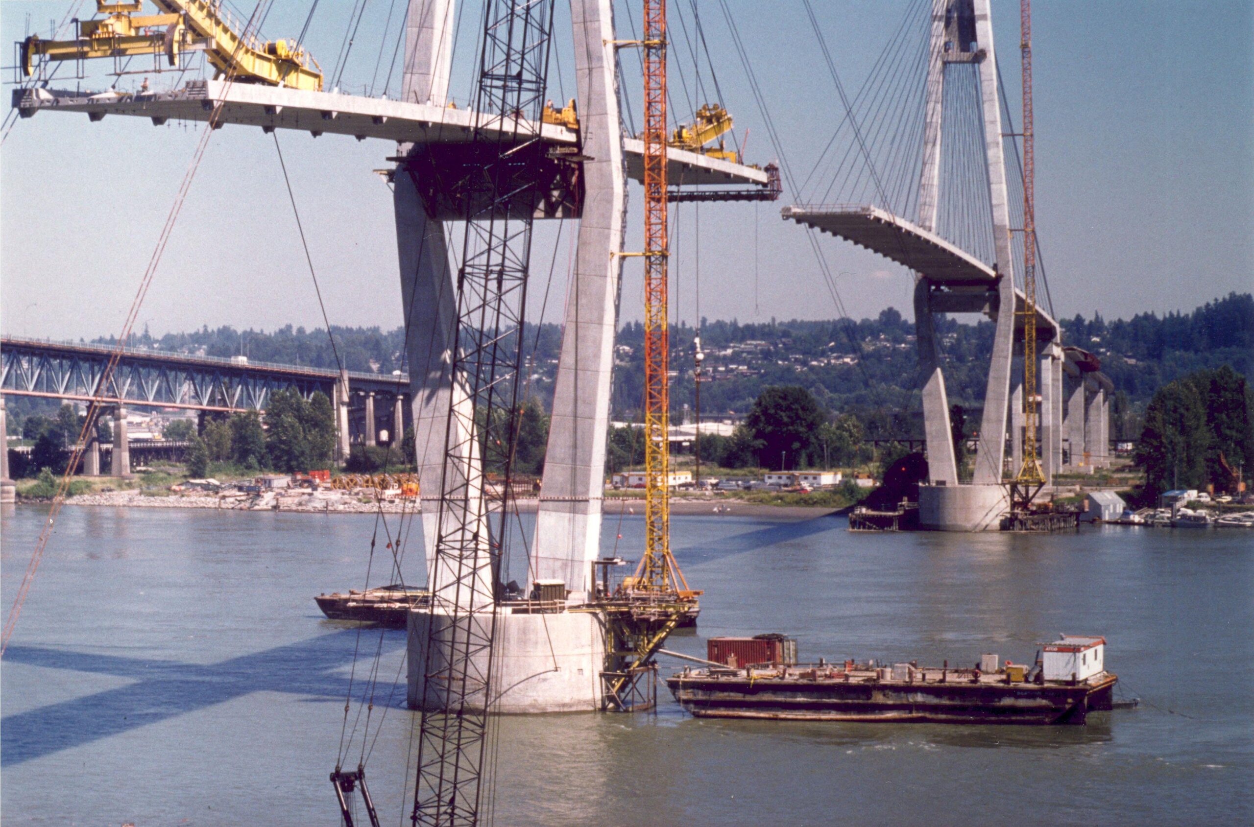 Two pillars of the SkyBridge stand in the Fraser River during construction