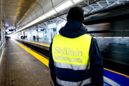 SkyTrain Attendant looks out on the guideway