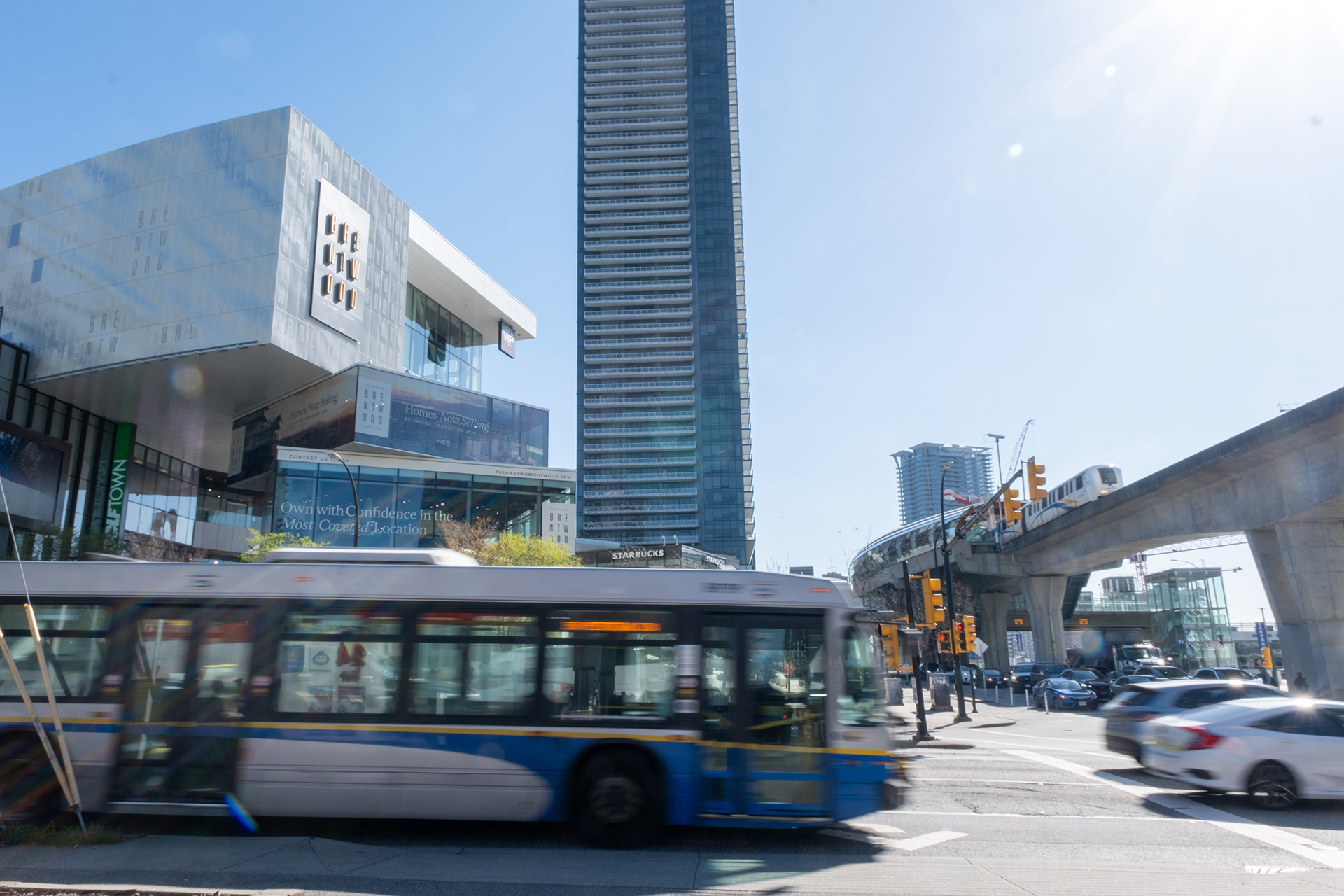 Bus and train passes by Brentwood Mall