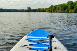 Tip of the paddleboard overlooking a lake